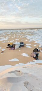 Premium camping site and 4x4 vehicles prepared for a Fayoum desert getaway in Egypt.